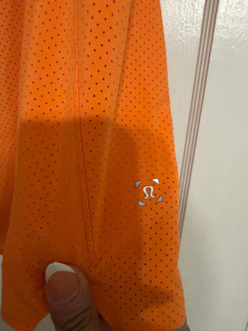lululemon orange perforated workout top with reflective logo